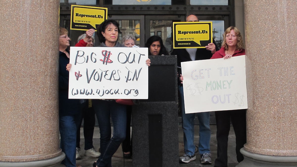  Activists protest large donations to candidates that can drown out the concerns of ordinary voters. (Phil Gregory/WHYY)  