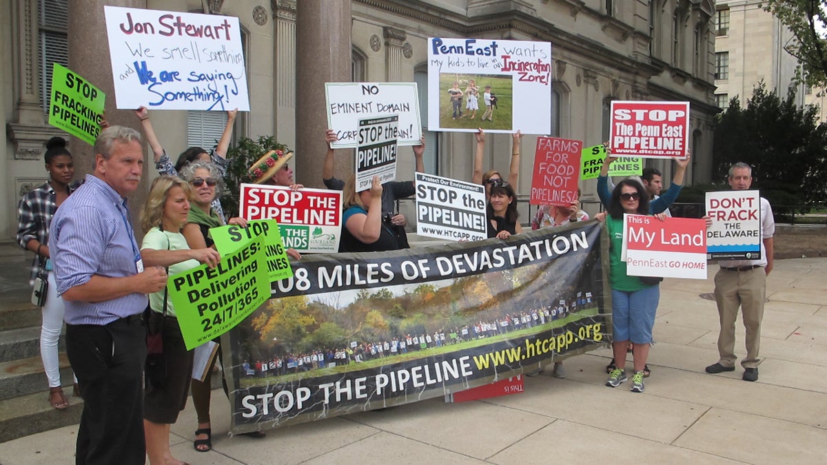  Representatives of groups opposed to the 115-mile PennEast natural gas pipeline gather at the New Jersey State House Tuesday to urge an end to the project. (Phil Gregory/WHYY)  