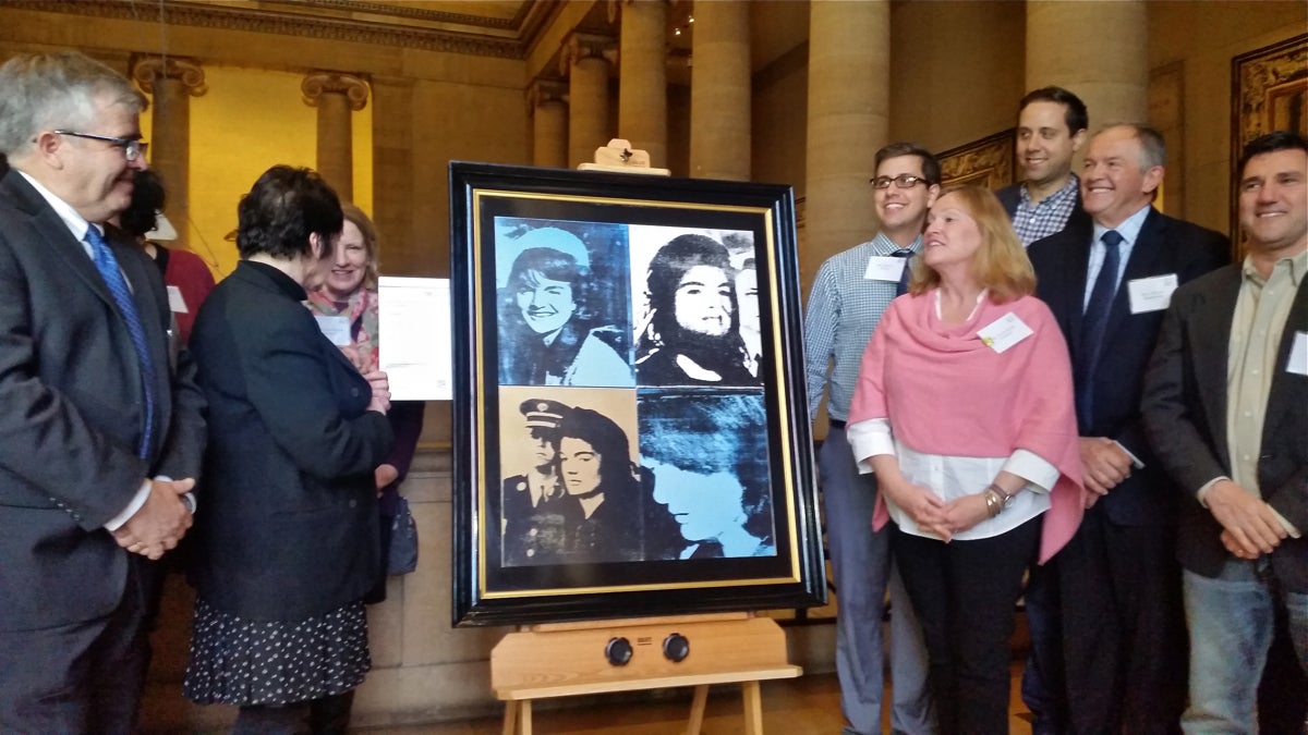 The Philadelphia Museum of Art unveils an Andy Warhol print that will be displayed outside the SawTown Tavern in Tacony as part of the museum's InsideOut program. (Peter Crimmins/WHYY)