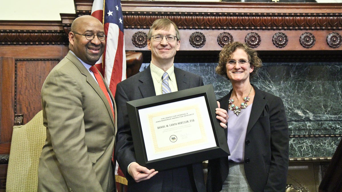  Mayor Michael Nutter (left) and Inspector General Amy Kurland (right) present Daniel Cantu-Hertzler  with the Inspector General’s Joan Markman Award for Integrity. (Kimberly Paynter/WHYY) 