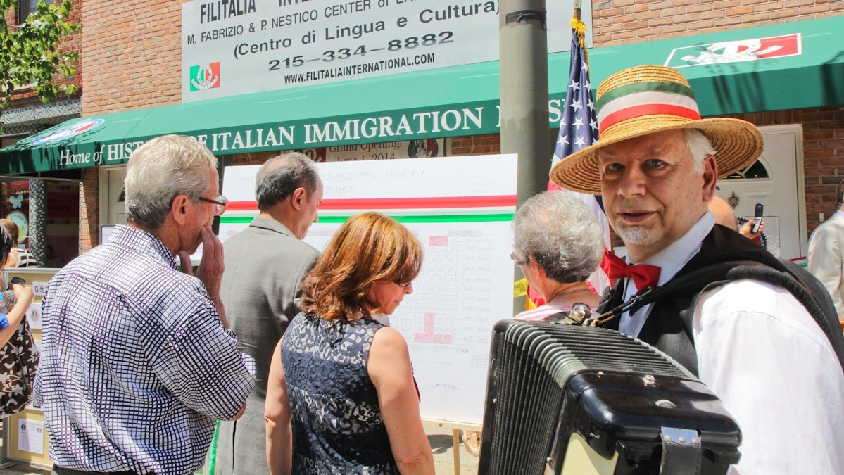  Nicolas Argentina, The Strolling Accordionist, plays Italian classics at the opening of the History of Italian Immigration Museum. (Kimberly Paynter/WHYY) 