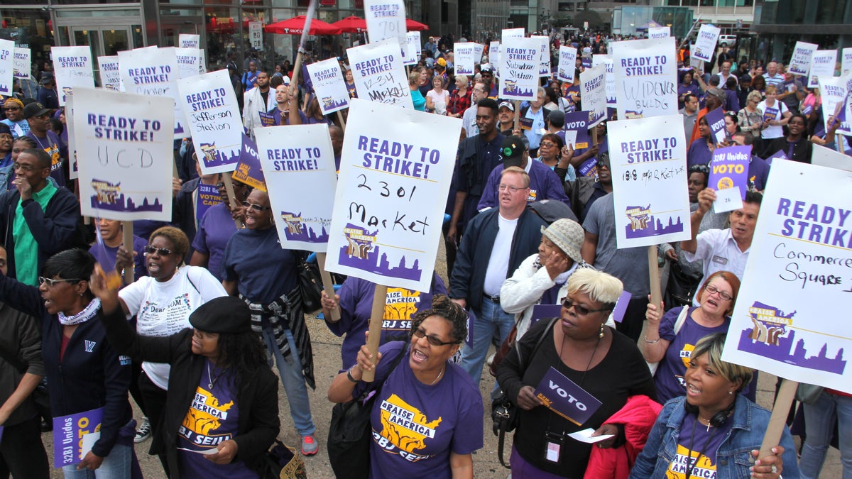  Commercial office cleaners rally in the courtyard of 1515 Market St. before a strike authorization vote. (Emma Lee/WHYY) 