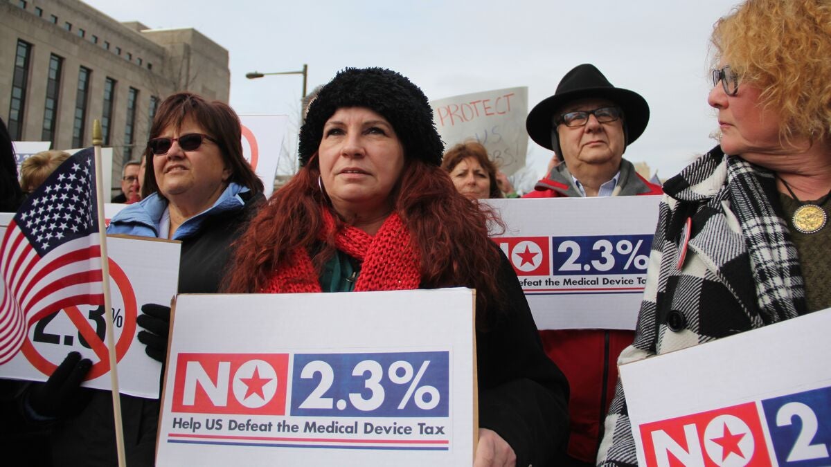  A group of protesters gathers outside 30th Street Station to rally against the medical device tax. Many were employees of B. Braun Medical, Inc. in Allentown, Pa. (Emma Lee/WHYY) 