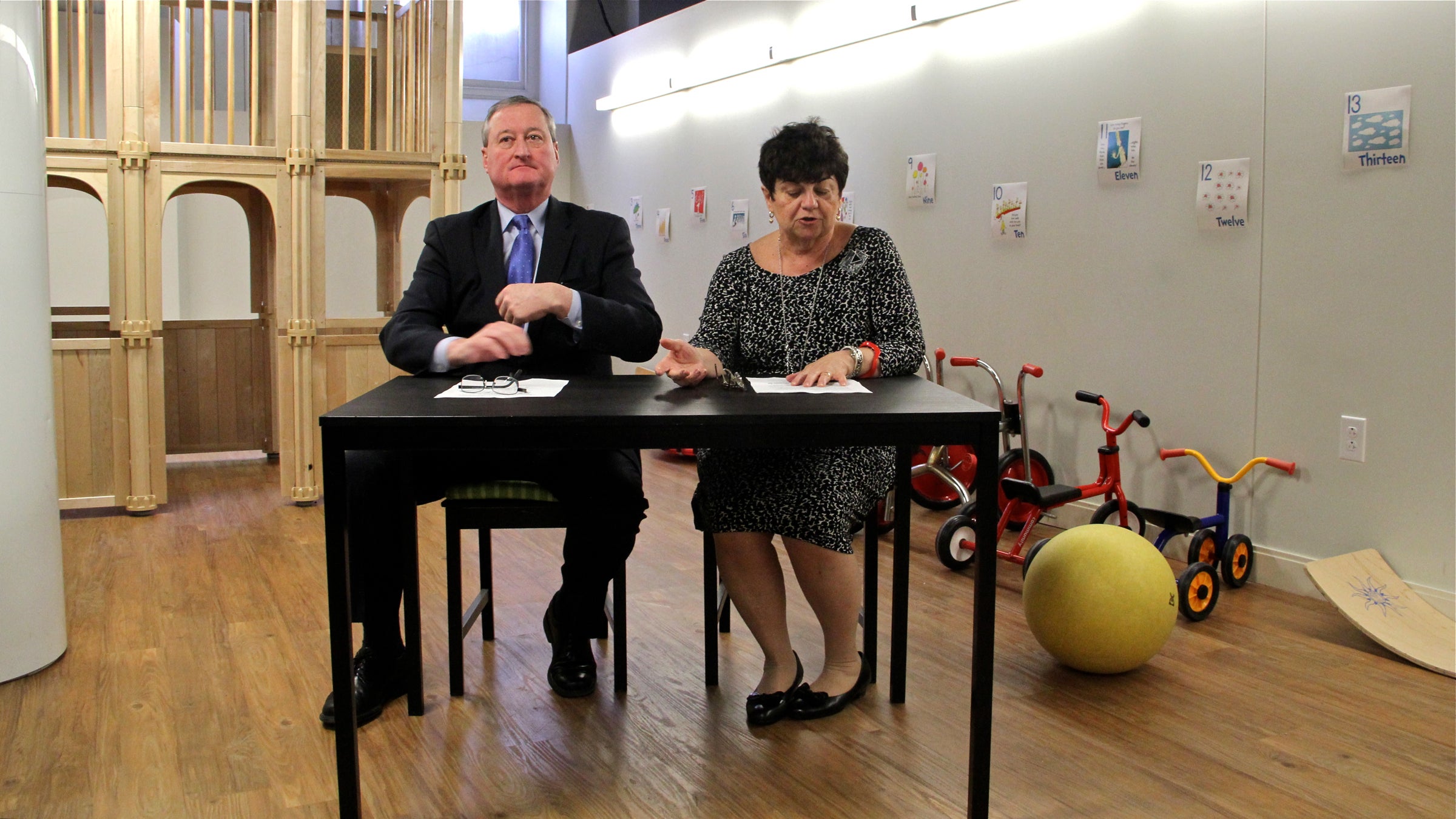  Mayoral candidate Jim Kenney presents his school-funding plan with the help of longtime Philadelphia teacher and librarian Rachelle Nocito at Philadelphia Cathedral Early Learning Center in West Philadelphia. (Emma Lee/WHYY) 