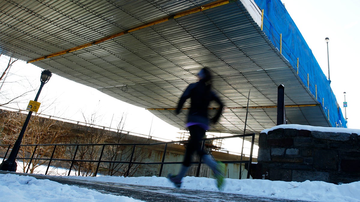  In this file image, a runner jogs beneath an overpass on the Schuylkill Banks path in Philadelphia, Pa. (AP Photo/Matt Rourke) 