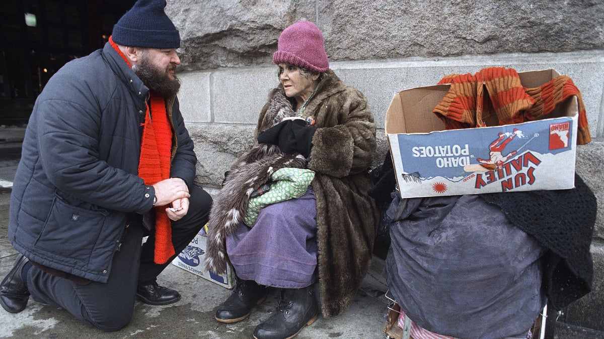  This 1987 photo shows Joseph Rogers, left, talking to Mary Valletta outside the Reading Terminal Market in Philadelphia. Roger led a group at the time that assisted homeless and deinstitutionalized people who live on the streets. (AP Photo/Charles Krupa) 