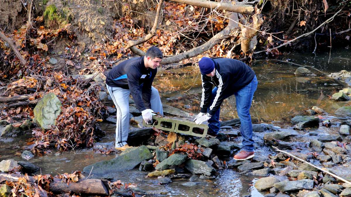 One team of volunteers cleared trash and debris from the portion of Cresheim Creek which dissects the six-acre park land.(Jana Shea/for NewsWorks) 