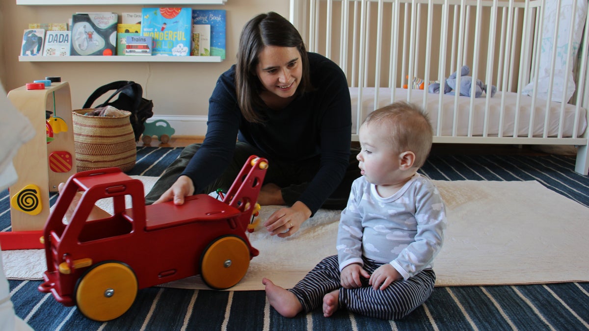 Katherine Gajewski plays with her son