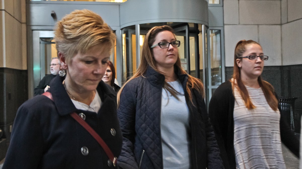  Kathryn Knott (center) exits the criminal justice center with her family and supporters after closing arguments. Knott is scheduled to be sentenced Monday (Kimberly Paynter/WHYY) 