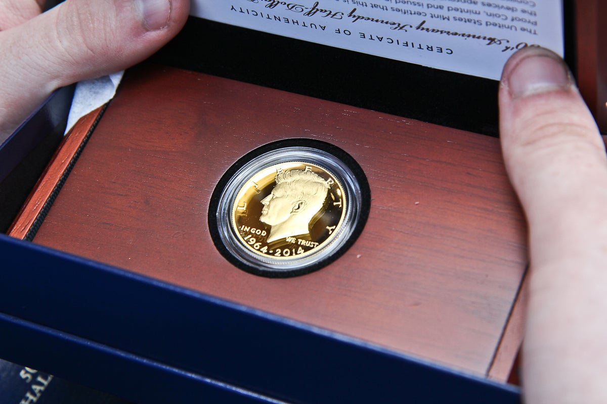  The 50th anniversary Kennedy half-dollar gold coin. (Kimberly Paynter/WHYY) 