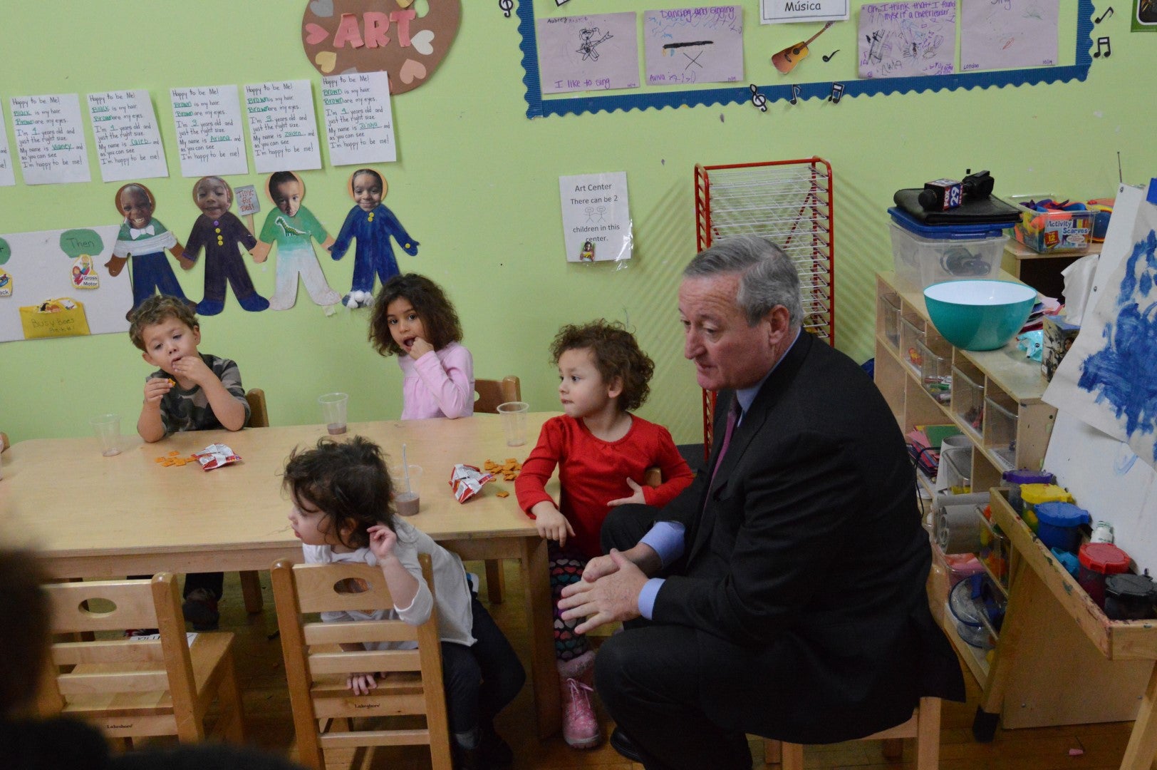 Philadelphia Mayor Jim Kenney sits with children at the Children's Playhouse pre-K in South Philadelphia. (Tom MacDonald