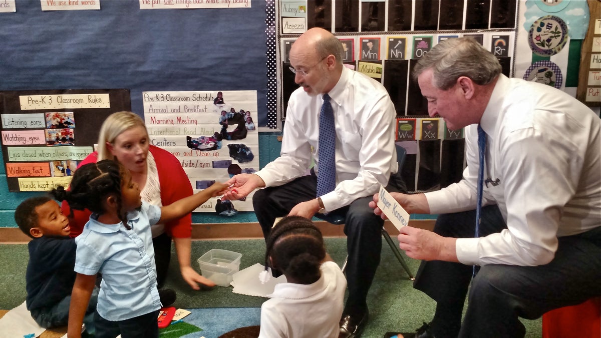  Four- and 5-year-olds in Erin Dowling's preschool class at the West Philadelphia Community Center play a game with Gov. Tom Wolf and Mayor Jim Kenney. (Katie Colaneri/WHYY) 