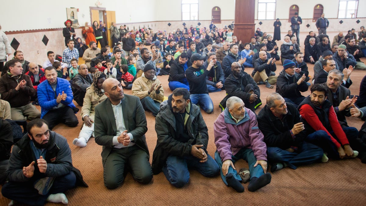 Muslims from the Philadelphia area listen to Mayor Jim Kenney speak during an interfaith service at the American Muslim Society Friday. (Brad Larrison for NewsWorks)