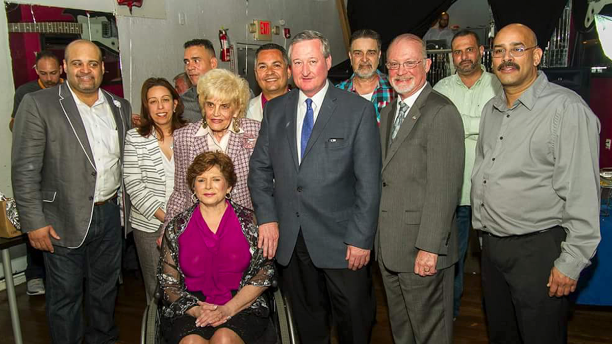  Amid a group of Democratic ward leaders, elected officials and allies, Philadelphia mayoral candidate Jim Kenney, center, stands with his hand on state Sen. Christine Tartaglione’s shoulder; 7th District Council candidate Manny Morales is pictured behind Kenney to his left. (Image courtesy of Barry Caro/Diaz Campaign) 