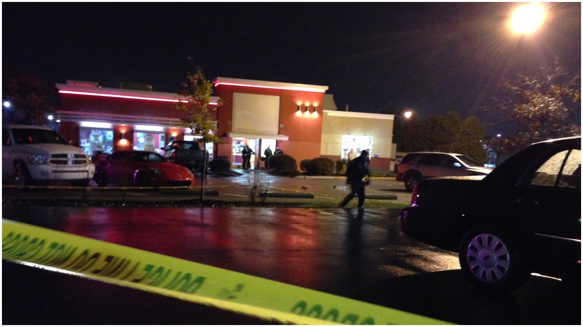  Police investigate a fatal shooting outside KFC in Newark. (John Jankowski/for NewsWorks)   
