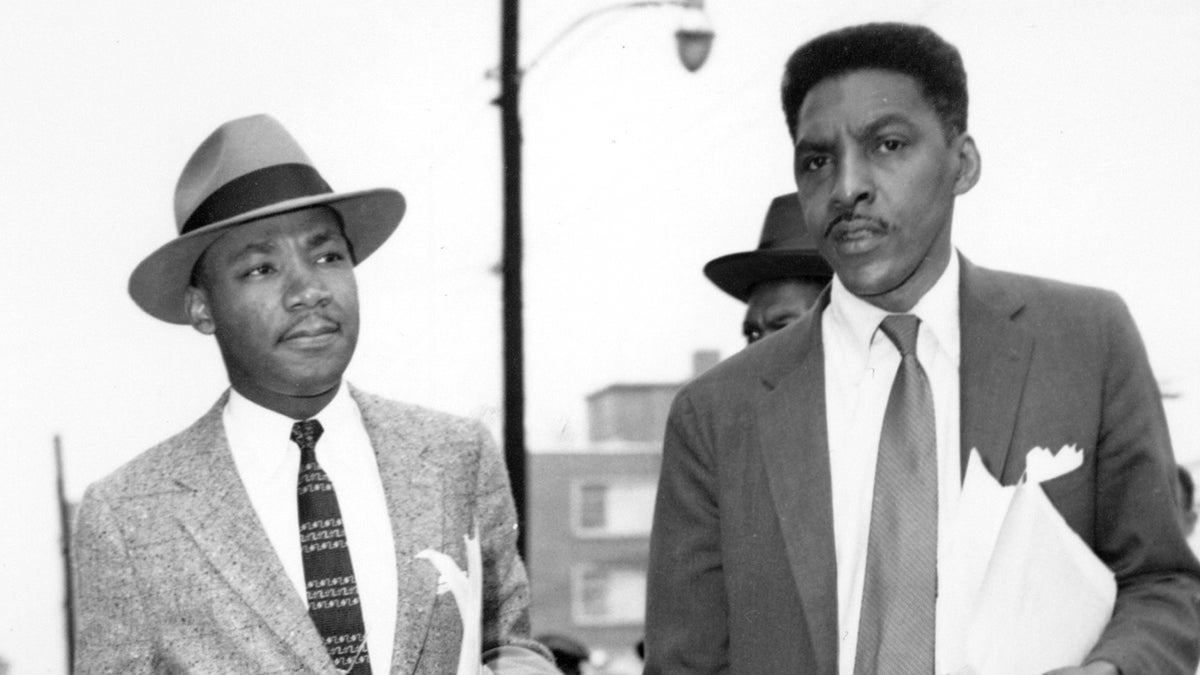  From left: Rev. Dr. Martin Luther King, Jr., and Bayard Rustin, two leaders in the Montgomery, Ala., bus boycott, are shown leaving the Montgomery County Courthouse on Feb. 24, 1956. (AP Photo) 