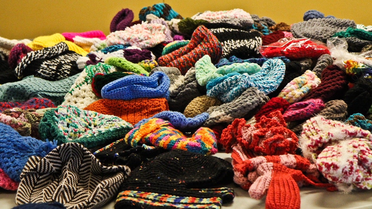 Scarves, hats, and mittens donated to the needy from knitters and crocheters from around the city. (Kimberly Paynter/WHYY)