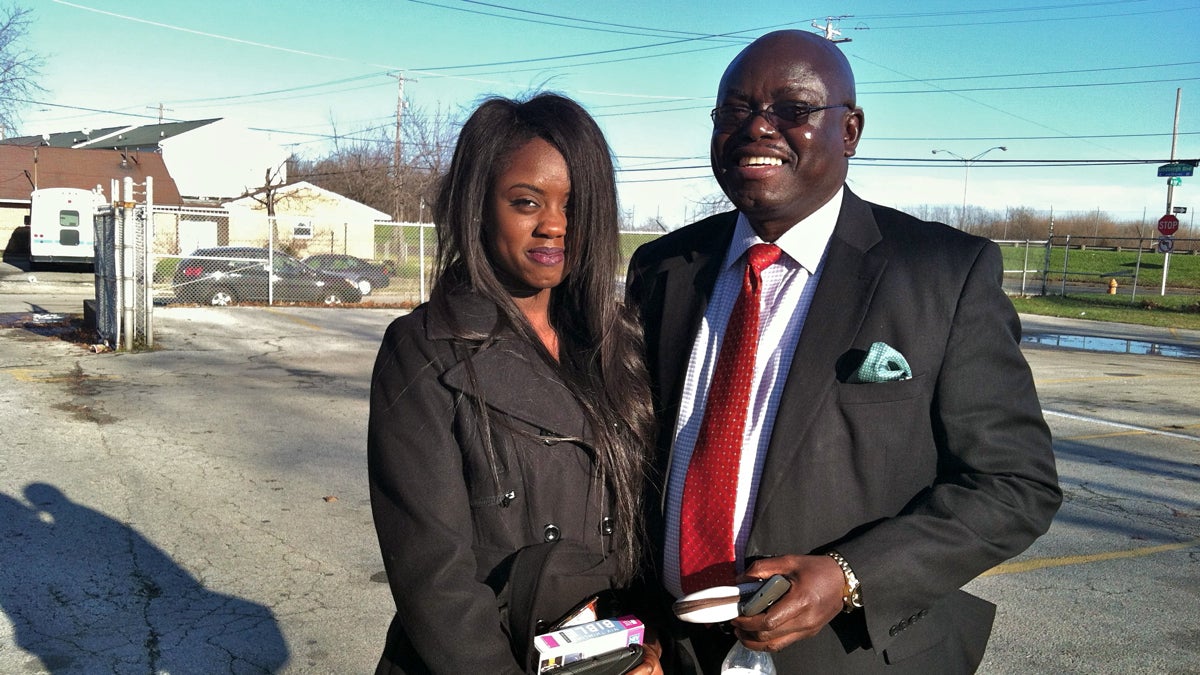  Psychotherapist Kpangbala Sengbe and his daughter Bendu, 17. (Elana Gordon/WHYY) 