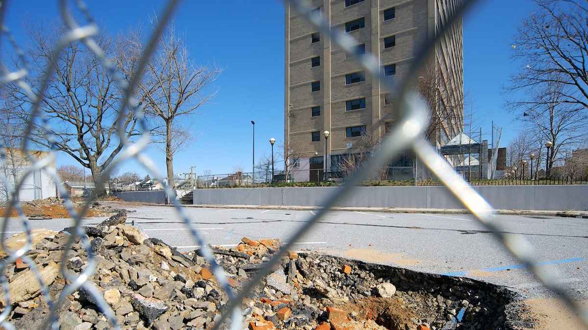  Bricks and debris are visible at one of the Potter's Field excavation sites behind the long-shuttered Queen Lane Apartments tower. (Bas Slabbers/for NewsWorks, file)  