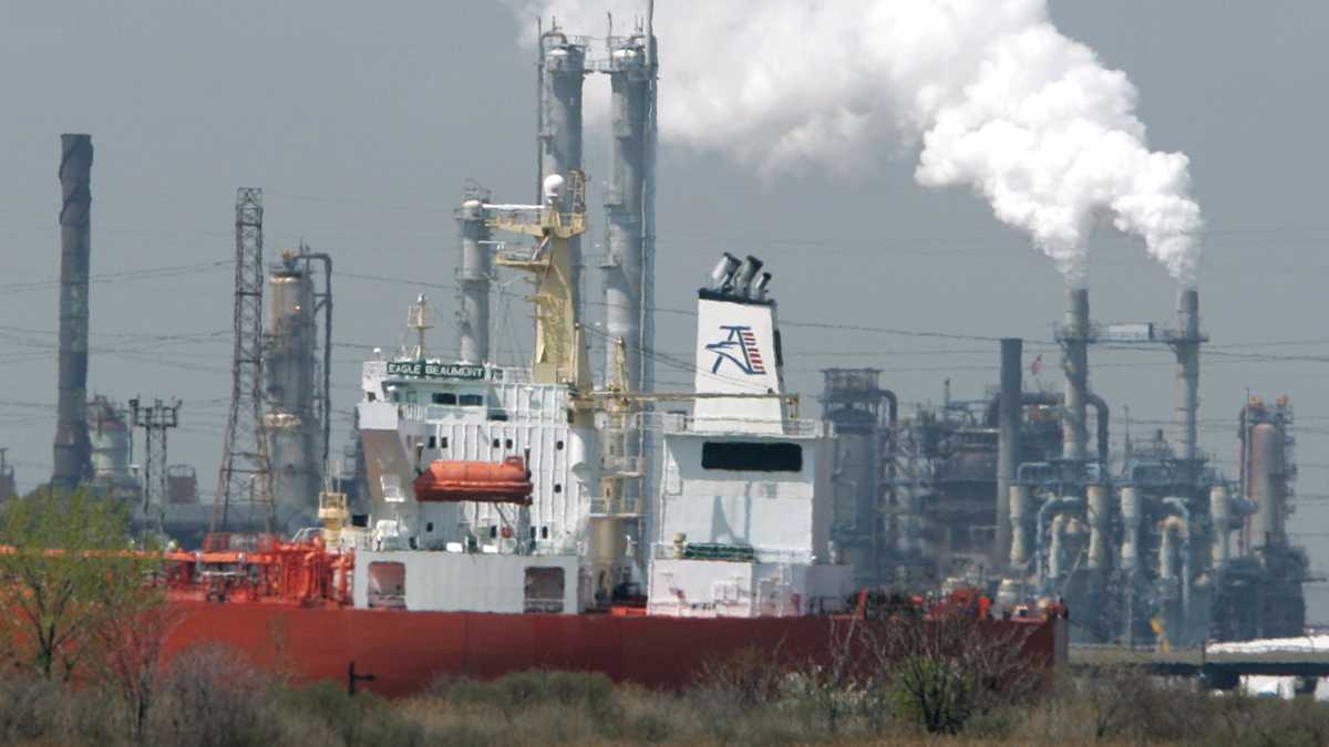  2008 file photo of an oil tanker is docked in Linden, N.J., with the Bayway refinery in background. (AP Photo/Mike Derer, file) 