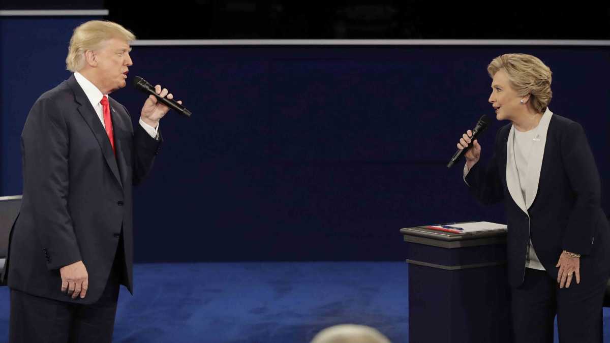 Republican presidential nominee Donald Trump and Democratic presidential nominee Hillary Clinton exchange words during the second presidential debate at Washington University in St. Louis