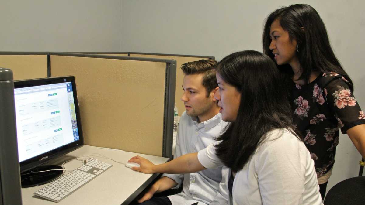 Young adults are often perplexed by insurance jargon when navigating the HealthCare.gov site.  By following study participants in real time as they shopped, researchers (from left) Mike Kaiser, Charlene Wong and Cjloe Vinoya now have recommendations for making the process easier. (Emma Lee/WHYY)  