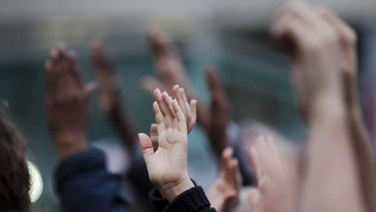  Demonstrators hold up their hands during a Wednesday protest in Philadelphia. On Friday, protesters gathered to urge shoppers to become socially and politically active following the events in Ferguson, Missouri. (Matt Rourke/AP photo) 