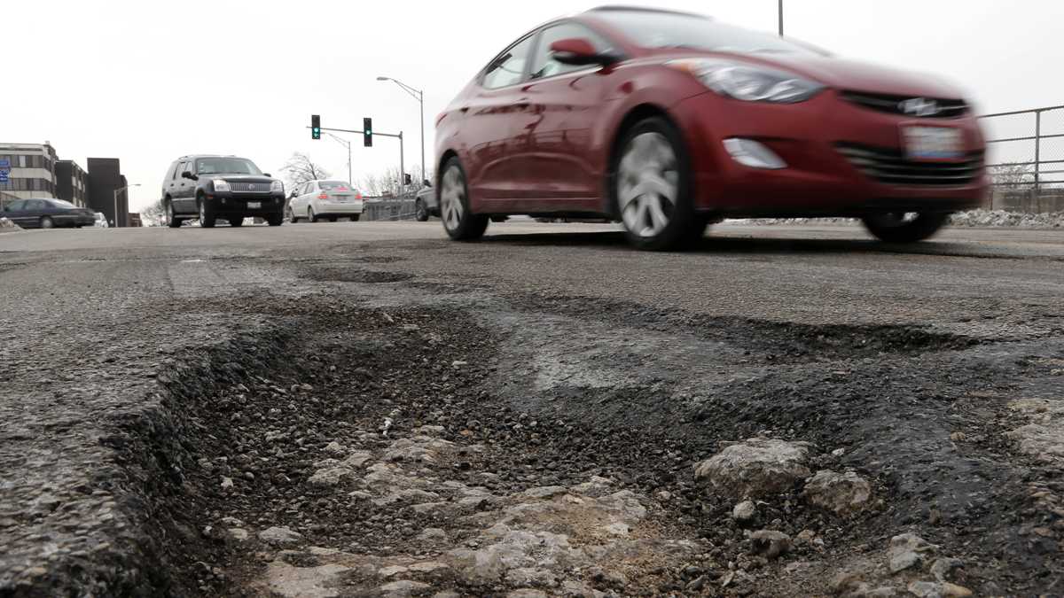  Are you willing to pay more for your car registration to help fill potholes on Philly streets? (AP Photo, file) 