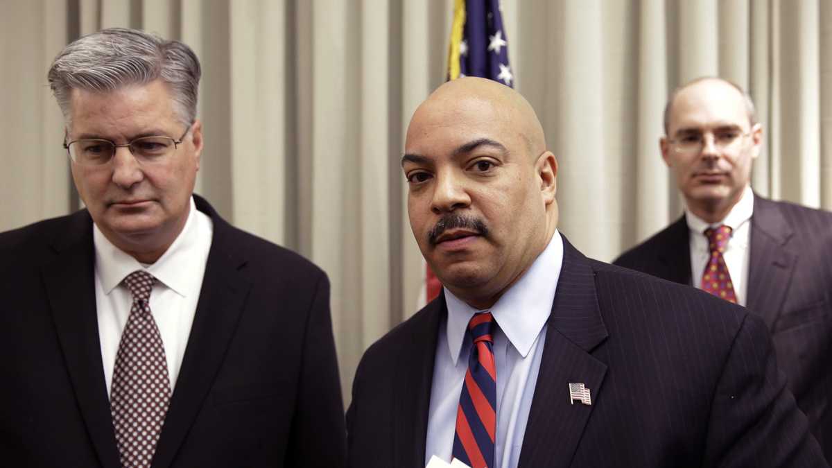 Philadelphia District Attorney Seth Williams accompanied by investigators Marc Costanzo