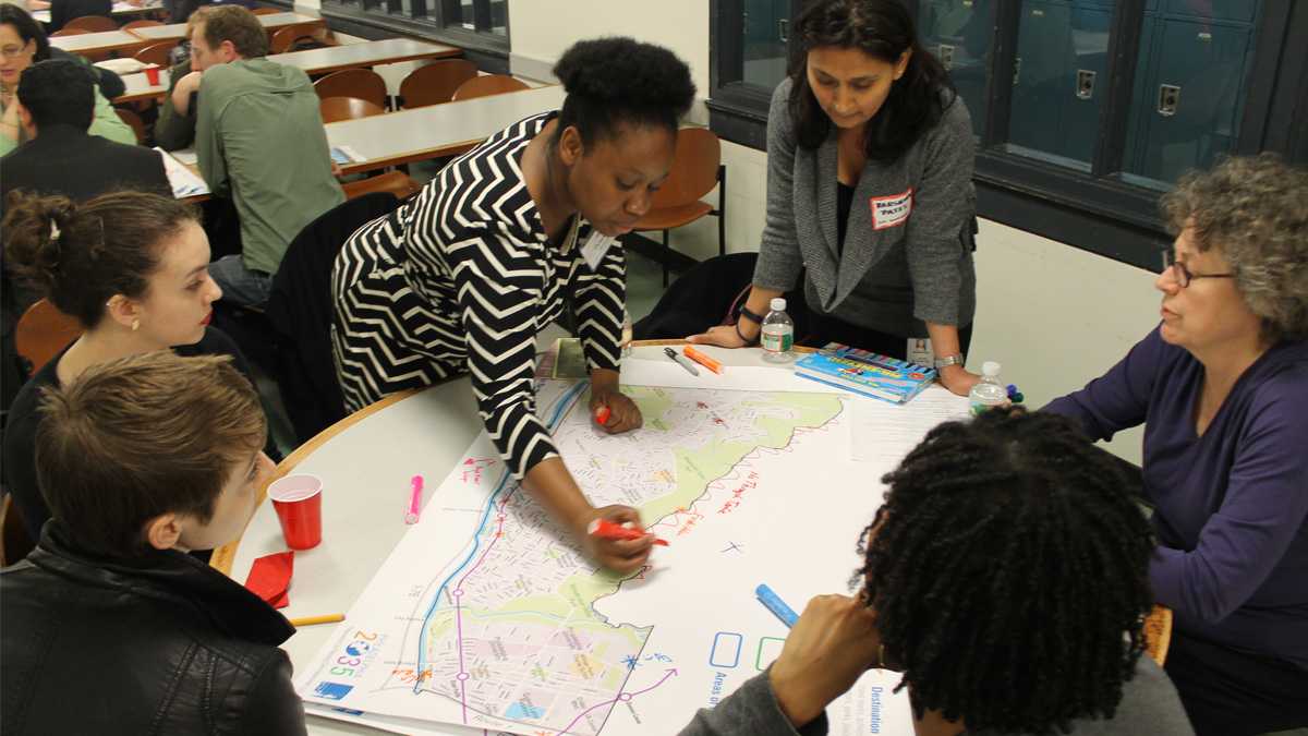  At a previous Philadelphia 2035 session,  Octavia Howell of the Philadelphia City Planning Commission recorded residents' input on the Lower Northwest District Plan. (Matthew Grady/WHYY)  