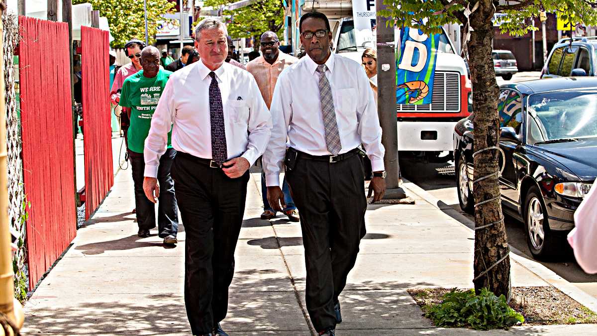   Mayoral candidate Jim Kenney (left) and City Council President Darrell Clarke tour North Philadelphia. (Brad Larrison/for NewsWorks)  