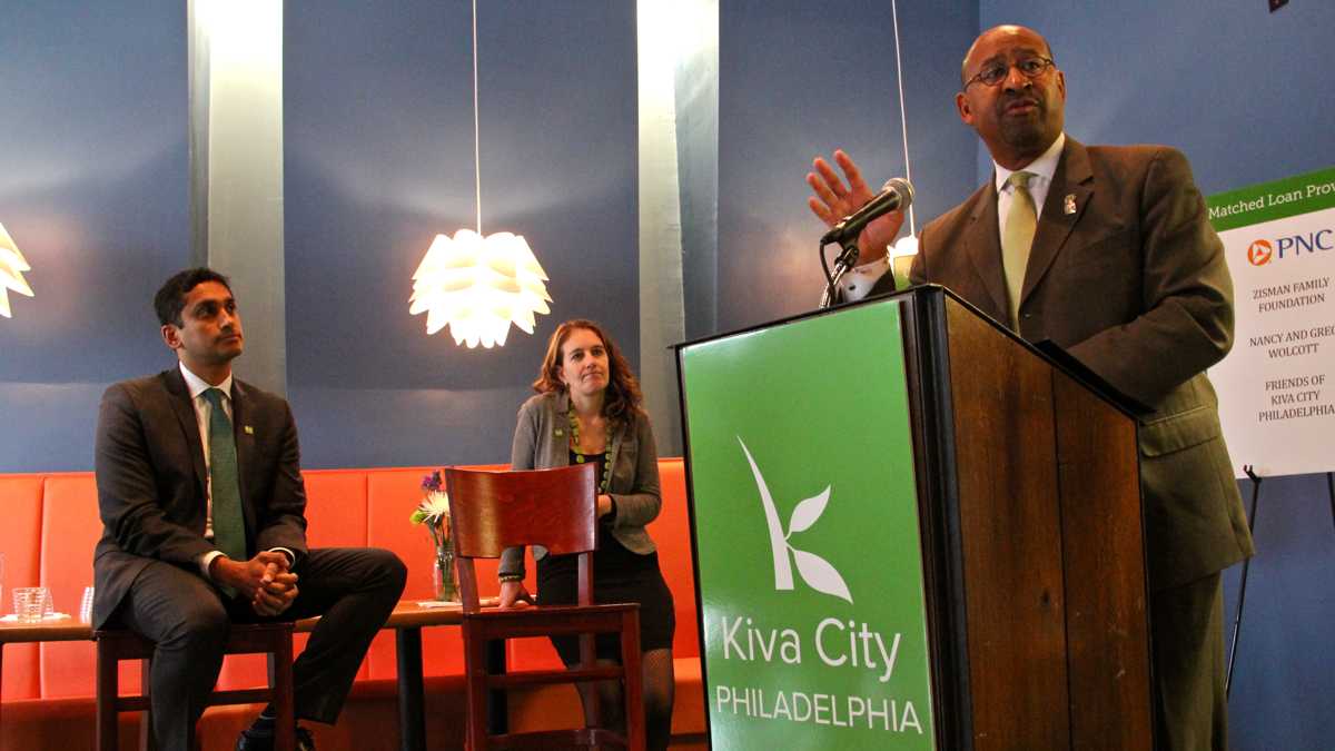  Mayor Michael Nutter announces a new initiative, Kiva City Philadelphia, that will provide interest-free loans to small businesses. At left is Kiva President Premal Shah. (Emma Lee/WHYY) 