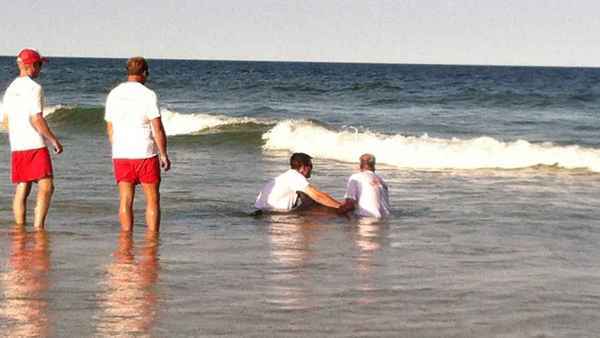  Lifeguards assisting a sick dolphin at Island Beach State Park earlier this month. The dolphin later died. (Photo: Sandy Bartkiewicz Rea via Jersey Shore Hurricane News) 