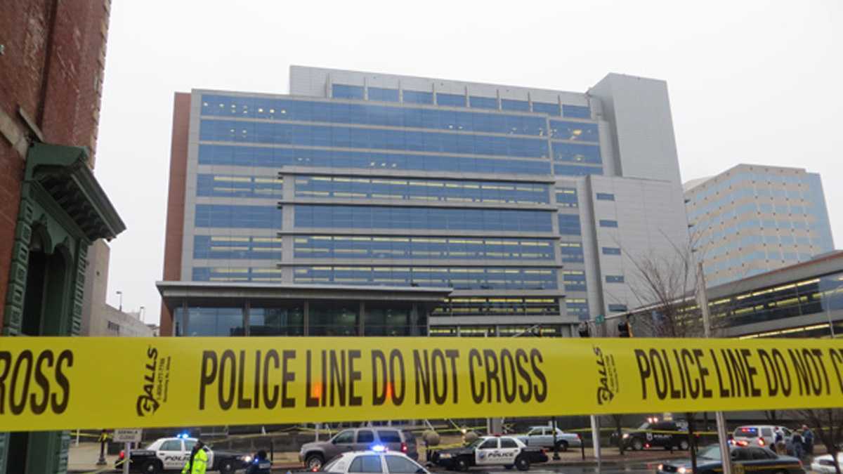  Police gather outside the New Castle County Courthouse in 2013 after two people were shot and killed by Thomas Matusiewicz. His relatives were sentenced to life in prison for their role in planning the attack. (File/WHYY) 