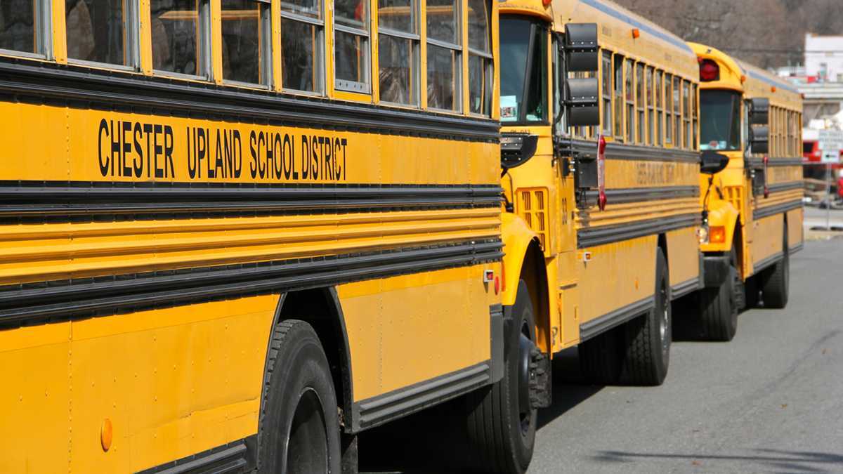 Buses from the financially troubled Chester Upland School District await dismissal at Chester High School on West Ninth Street. (Emma Lee/NewsWorks file photo)