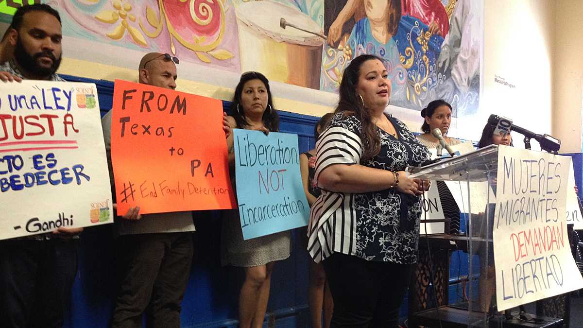  In June, Erika Almiron, executive director of Juntos, a Latino community advocacy organization, calls for closing the Berks Family Detention Center and the release of its residents. The Pennsylvania Department of Human Services has decided not to renew the center's license.   (NewsWorks file photo) 
