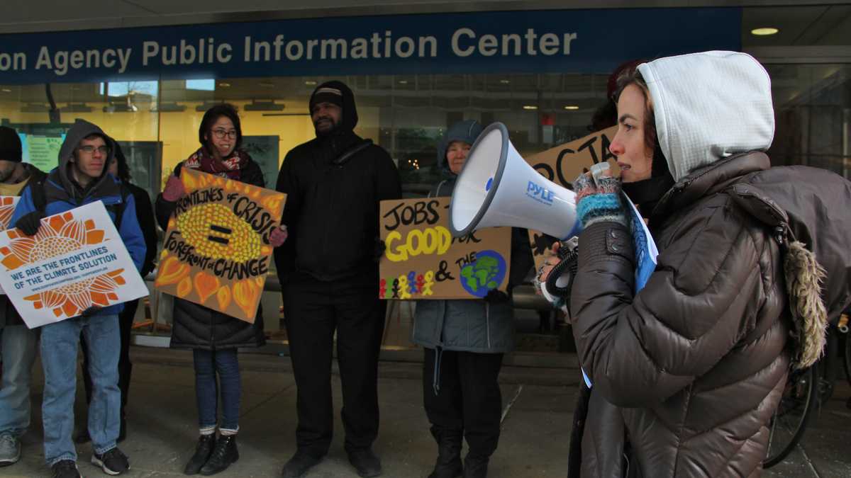 Demonstrators from the Climate Justice Alliance are shown rallying outside the Environmental Protection Agency in Center City in January 2016. (Emma Lee/WHYY)