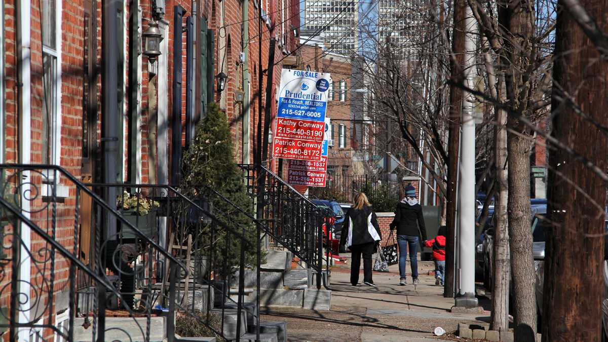 Homes are advertised for sale on Second Street in Philadelphia's Queen Village neighborhood. (Emma Lee for NewsWorks