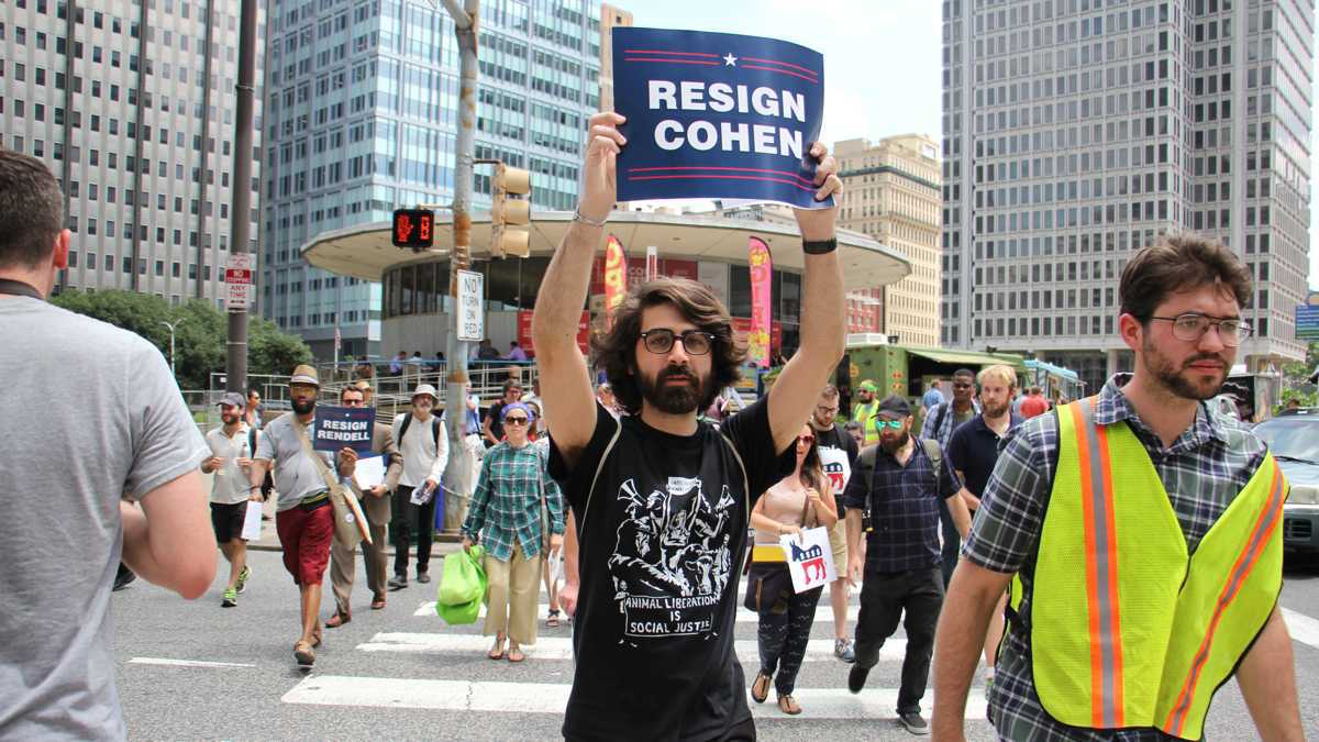 Members of Reclaim Philadelphia march through Center City to demand that the DNC reveal its sources of funding. (Emma Lee/WHYY)