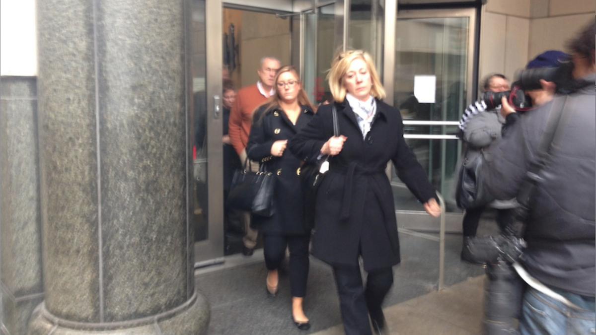  Kathryn Knott (center), one of three defendants charged with assaulting a gay couple in Center City, leaves the courthouse. (Brian Hickey/WHYY)  