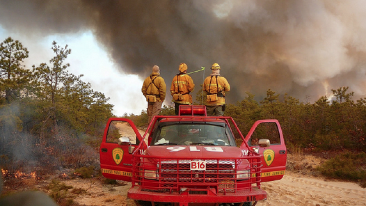 Wardens from the New Jersey Forest Fire Service District B3 check the progress on a March 2013 prescribed burn in the Warren Grove Gunnery Range. Pictured from left: Chad Bozoski, George Jackson III and Steve Pratt. (Photo courtesy of George Gerber III, NJFFS) 