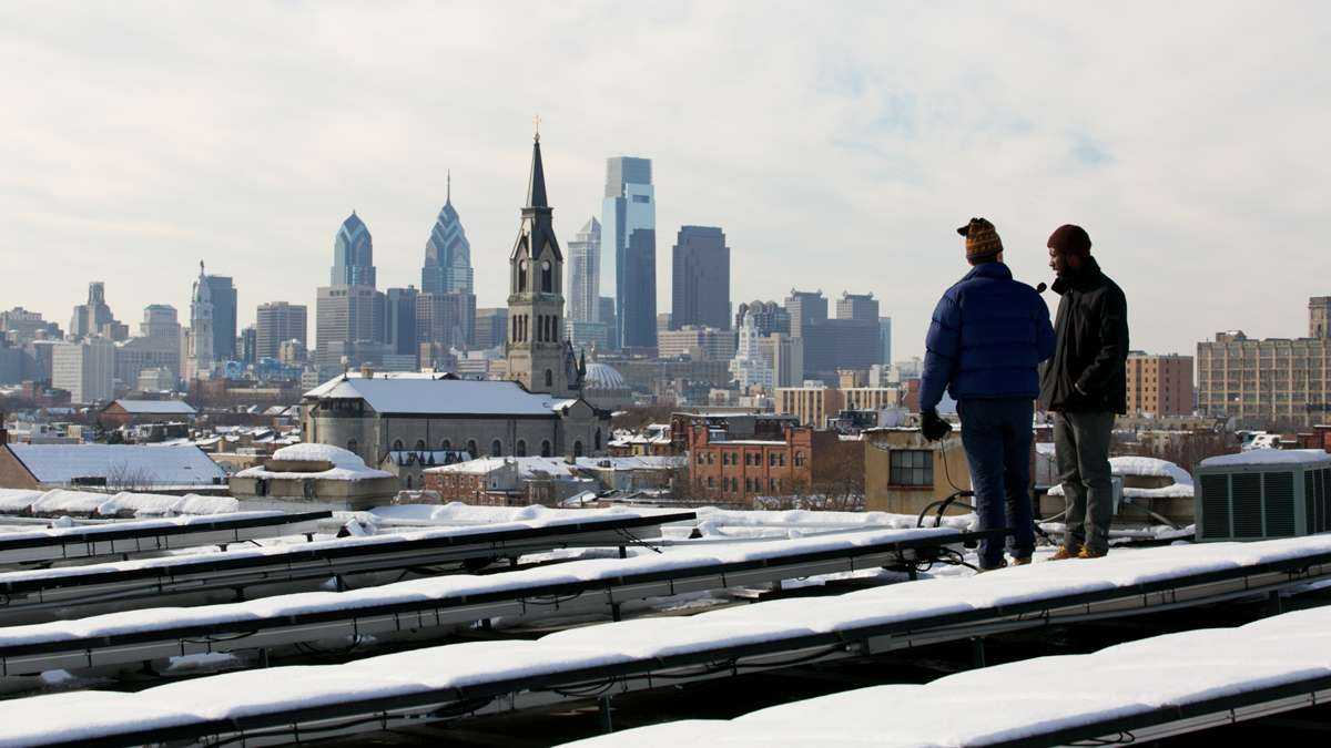  Snow-covered solar panels are shown on the rooftop of the Crane Arts building in Philadelphia's South Kensington neighborhood. (Nathaniel Hamilton/WHYY, file) 