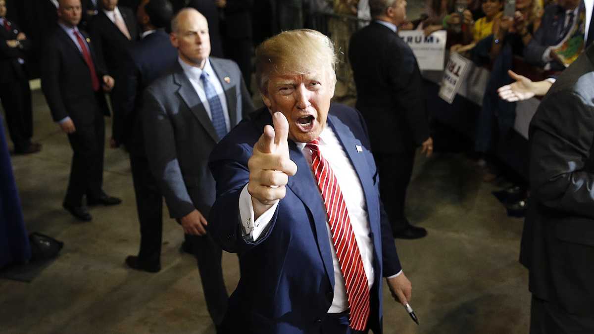 Republican presidential candidate Donald Trump acknowledges photographers after speaking at a campaign rally in Baton Rouge