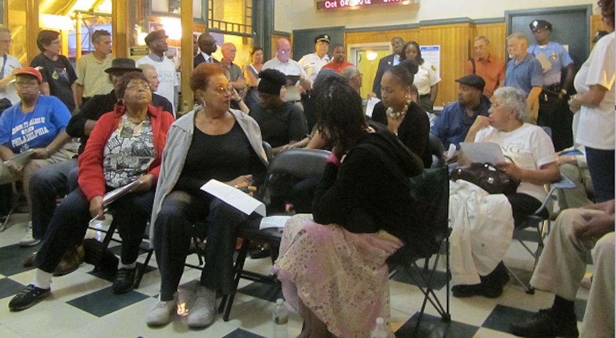  Residents discuss community issues at a meeting inside the Queen Lane Station. (Aaron Moselle/WHYY, file) 