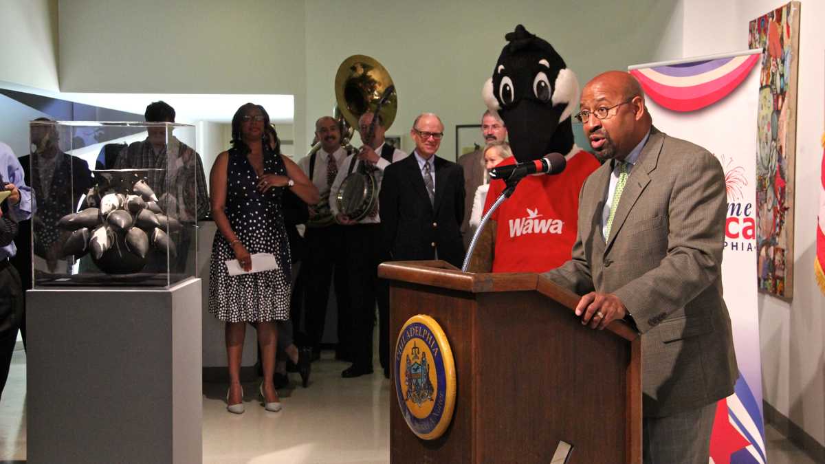  With literal fanfare, Mayor Michael Nutter announces the return of the Wawa Welcome America July 4 celebration featuring fireworks, free sandwiches and The Roots. (Emma Lee/WHYY) 