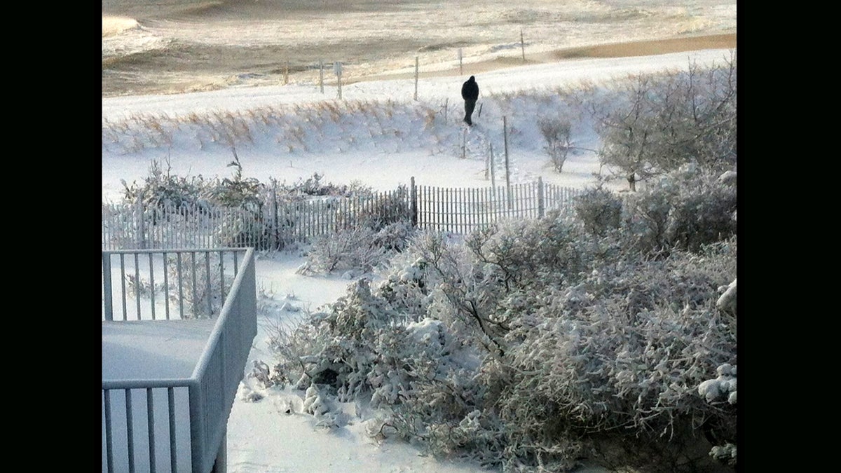  Kurt Zollinger visiting from Graniteville, SC makes his way over snow-covered dunes in Holgate on Long Beach Island, NJ. (Photography by Peter Tobia) 