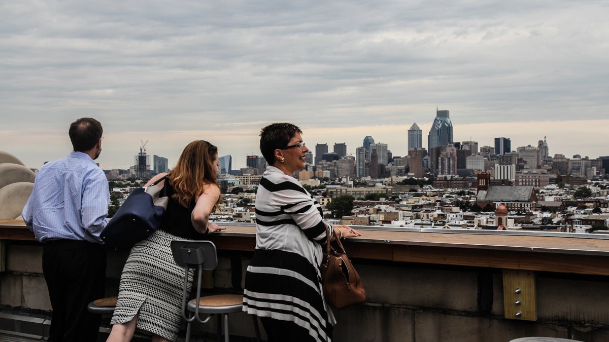 Le Bok Fin’s first patrons enjoy the rooftop view at the former high school. (Kimberly Paynter/WHYY)