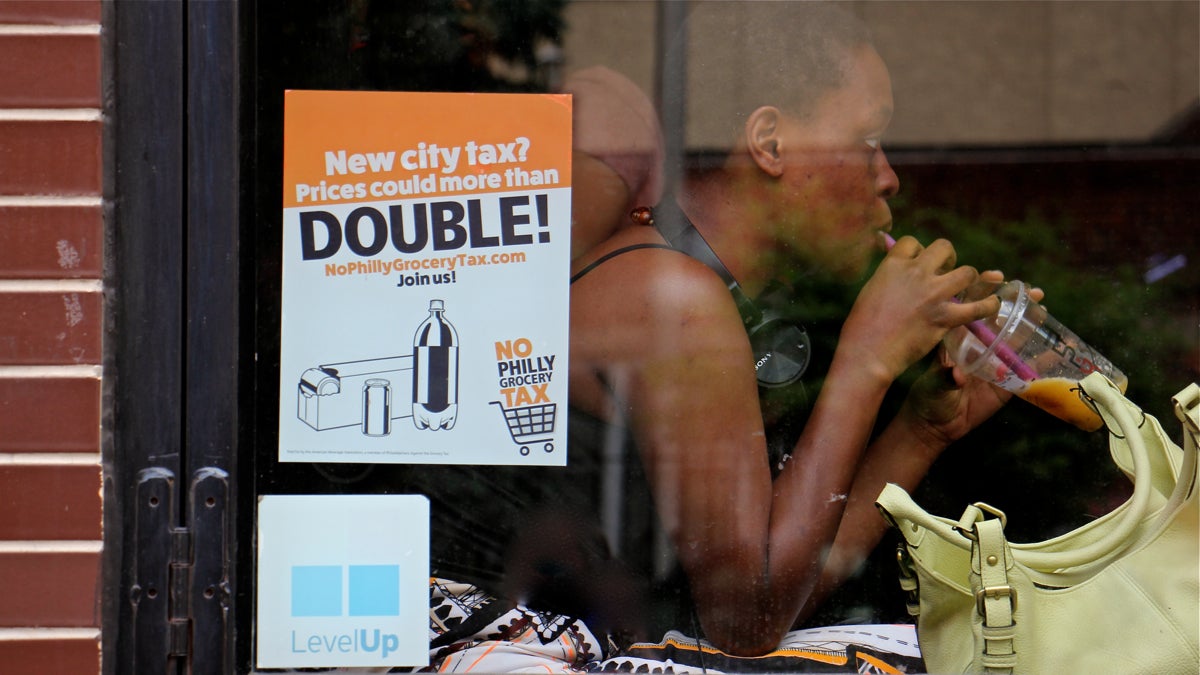 A customer enjoys a bubble tea at TeaDo in Philadelphia's Chinatown neighborhood. The proposed sugary drink tax would add three cents an ounce to the cost of a beverage. (Emma Lee/WHYY)