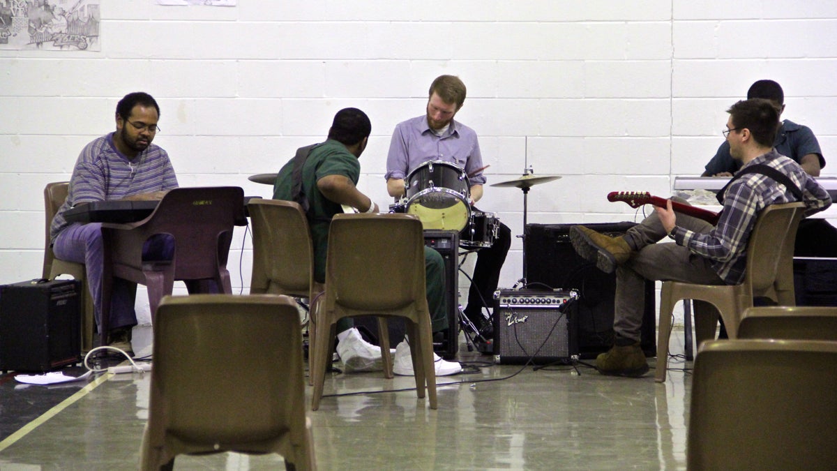 Young inmates at Philadelphia Industrial Correctional Center are learning to play musical instruments thanks to the efforts of a small group of volunteers. (Emma Lee/WHYY)