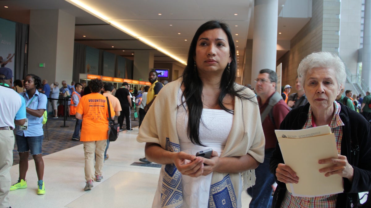  Nicole Santamaria (left), an intersex woman who traveled from El Salvador to attend the World Meeting of Families, and Sister Jeannine Gramick of Equally Blessed prepare to check in at the Pennsylvania Convention Center. (Emma Lee/WHYY) 